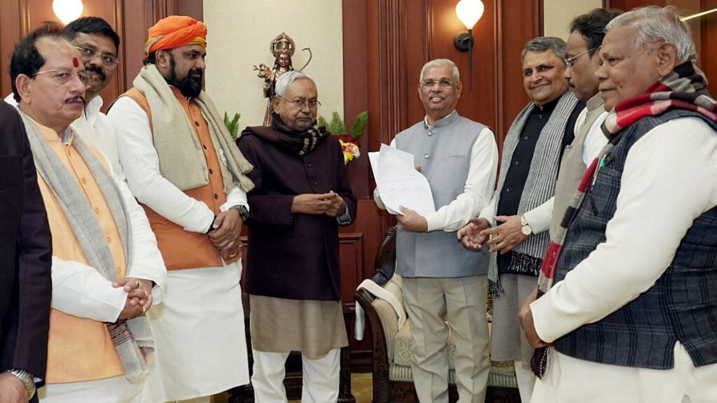 Bihar newly sworn-in Chief Minister Nitish Kumar with Leader of Opposition of State Assembly and BJP leader Vijay Kumar Sinha, party state president Samrat Choudhary with others at Raj Bhavan, in Patna on Sunday