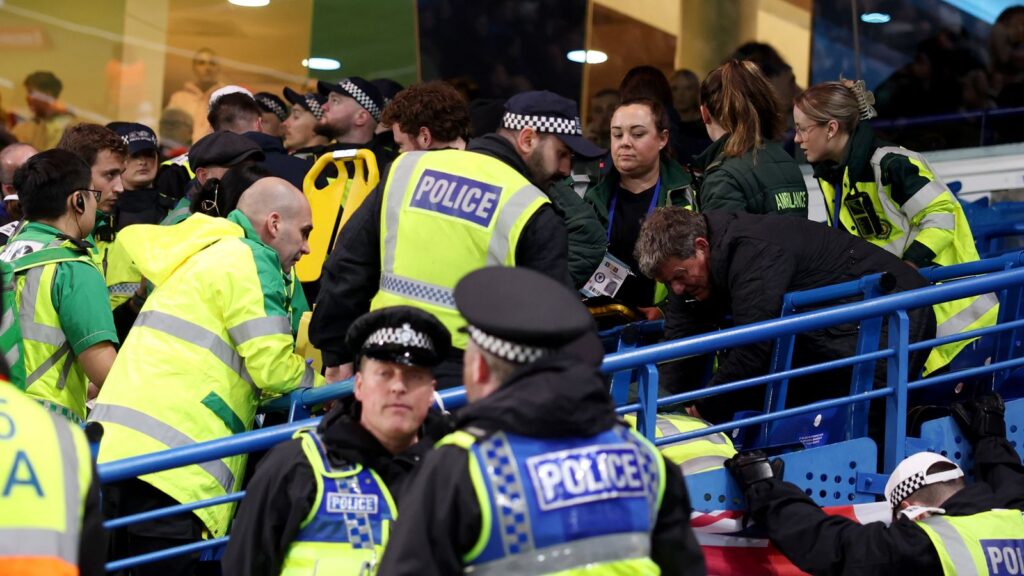 A Leeds fan receives treatment at Chelsea