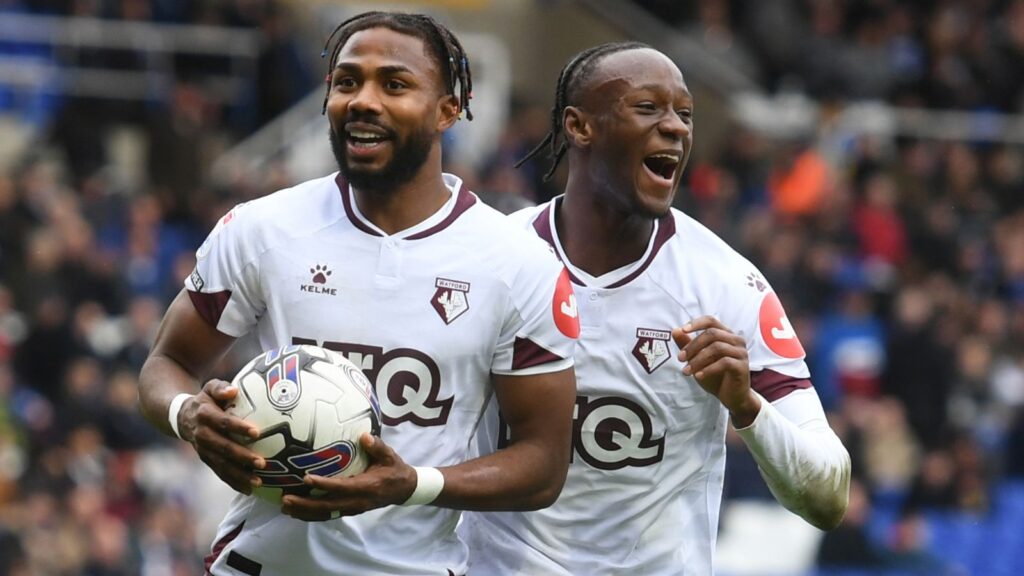 Emmanuel Dennis celebrates after scoring for Watford at Birmingham